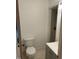 Neat bathroom with toilet, single sink vanity, and walk in shower with neutral tiling and modern fixtures at 1225 Fairlane Rd, Cary, NC 27511