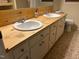 Bathroom with double sinks and natural wood countertop at 1225 Fairlane Rd, Cary, NC 27511