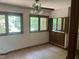 Bedroom with ceiling fan, windows, and built-in storage at 1225 Fairlane Rd, Cary, NC 27511