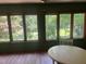 Bright dining area with large windows and wood-look flooring at 1225 Fairlane Rd, Cary, NC 27511
