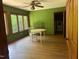Dining area with windows, wood-look floor, and laundry room at 1225 Fairlane Rd, Cary, NC 27511