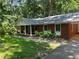Beautiful brick home with charming front porch and mature landscaping at 1225 Fairlane Rd, Cary, NC 27511