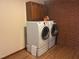 Laundry Room with appliances and brick wall at 1225 Fairlane Rd, Cary, NC 27511