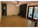 Spacious living room with a unique fireplace, a ceiling fan, and access to an enclosed porch at 1225 Fairlane Rd, Cary, NC 27511