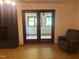 Bright sunroom with large windows and a ceiling fan located just off the living room at 1225 Fairlane Rd, Cary, NC 27511