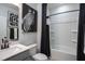 Elegant bathroom with a sleek vanity, modern fixtures, and a separate shower and tub at 133 Black Cloud Dr, Louisburg, NC 27549