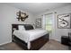 Spacious bedroom with a large bed, ample natural light from a large window, and tasteful decorations at 133 Black Cloud Dr, Louisburg, NC 27549