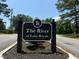 Attractive community sign for 'The River at Lake Royale' with manicured landscaping at 133 Black Cloud Dr, Louisburg, NC 27549