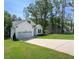 Charming two-story home with a well-manicured lawn and attached two-car garage at 133 Black Cloud Dr, Louisburg, NC 27549
