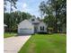 Charming single-Gathering home featuring a well-manicured lawn and attached two-car garage at 133 Black Cloud Dr, Louisburg, NC 27549