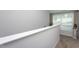 Bright hallway with neutral walls and trim and good natural light from a nearby window at 133 Black Cloud Dr, Louisburg, NC 27549