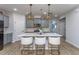 Modern kitchen with sleek countertops, stainless steel appliances, and stylish pendant lighting at 133 Black Cloud Dr, Louisburg, NC 27549