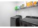 Well-equipped laundry room with modern washer and dryer units and ample storage space for supplies at 133 Black Cloud Dr, Louisburg, NC 27549