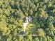 Bird's-eye view of home with a long driveway surrounded by trees at 136 Vireo Ln, Hillsborough, NC 27278
