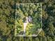 Aerial view of property lines for a home, showcasing its location amidst lush greenery at 136 Vireo Ln, Hillsborough, NC 27278