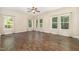 Spacious bedroom with hardwood floors, multiple windows, and lots of natural light at 136 Vireo Ln, Hillsborough, NC 27278