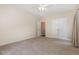 Clean bedroom features plush carpet, natural light, and a ceiling fan at 136 Vireo Ln, Hillsborough, NC 27278