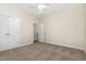 A cozy bedroom features neutral walls, carpeting, closet, and a door to the rest of the home at 136 Vireo Ln, Hillsborough, NC 27278