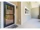 Close-up of the front door featuring black accents, a charming welcome mat, and clean siding at 136 Vireo Ln, Hillsborough, NC 27278