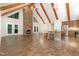 Open floorplan with a stone fireplace, kitchen island, and hardwood floors, perfect for entertaining at 136 Vireo Ln, Hillsborough, NC 27278