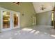 View of porch, from exterior, with exposed wood and doors leading to the house at 136 Vireo Ln, Hillsborough, NC 27278