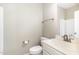 A half bath with a single sink vanity, toilet, mirror, and shower at 14 Water Front Ln, Timberlake, NC 27583