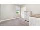 A bedroom with a dresser, window and a closet with a white wooden door at 14 Water Front Ln, Timberlake, NC 27583
