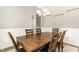 Cozy dining area with a solid wood table, six chairs, and wainscoting at 14 Water Front Ln, Timberlake, NC 27583