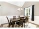 Elegant dining room featuring a wooden table, six chairs, and a stylish chandelier at 14 Water Front Ln, Timberlake, NC 27583
