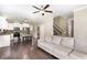 Spacious living area connects kitchen and Gathering room with hardwood floors and comfortable furniture at 14 Water Front Ln, Timberlake, NC 27583