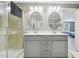 Bathroom featuring a glass enclosed shower, double vanity, and modern fixtures at 1419 Endgame Ct, Wake Forest, NC 27587