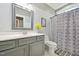 Bathroom vanity with decorative accents, including a stylish mirror and floral arrangement at 1419 Endgame Ct, Wake Forest, NC 27587