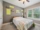 This modern bedroom boasts a stylish bed, contemporary decor, and an abundance of natural light at 1419 Endgame Ct, Wake Forest, NC 27587