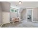 Upstairs bonus room with a table, chairs, and a glimpse into the bedroom at 1419 Endgame Ct, Wake Forest, NC 27587