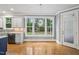 Bright, open kitchen area featuring hardwood floors, stainless steel appliances, and a view to the backyard at 1419 Endgame Ct, Wake Forest, NC 27587