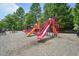 A colorful community playground includes several slides and playground equipment for outdoor fun at 1419 Endgame Ct, Wake Forest, NC 27587