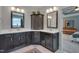 Bathroom with double sink vanity, white countertops, and decorative center cabinet at 149 N Serenity Hill Cir, Chapel Hill, NC 27516