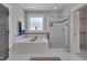 Elegant bathroom featuring a soaking tub, walk-in shower, and neutral color scheme at 149 N Serenity Hill Cir, Chapel Hill, NC 27516