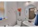 Charming powder room with decorative wall art, vessel sink, and neutral paint color at 149 N Serenity Hill Cir, Chapel Hill, NC 27516