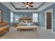 Serene bedroom with trey ceiling, neutral carpet, and plentiful natural light from windows at 149 N Serenity Hill Cir, Chapel Hill, NC 27516