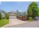 Charming two-story home with a two-car garage and a spacious driveway on a clear, sunny day at 149 N Serenity Hill Cir, Chapel Hill, NC 27516