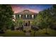 Charming two-story home with inviting front porch and stairway leading to the front door under a beautiful sunset at 149 N Serenity Hill Cir, Chapel Hill, NC 27516