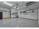 Well-lit garage features epoxy flooring, overhead storage, and space for multiple cars with easy access at 149 N Serenity Hill Cir, Chapel Hill, NC 27516