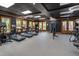 Well-equipped community gym with treadmills, exercise bikes, and weight machines in a spacious and modern setting at 149 N Serenity Hill Cir, Chapel Hill, NC 27516