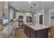 Spacious kitchen showcasing an island with seating, stainless steel appliances, and granite countertops at 149 N Serenity Hill Cir, Chapel Hill, NC 27516