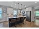 Modern kitchen featuring a large island with seating, granite countertops, and stainless appliances at 149 N Serenity Hill Cir, Chapel Hill, NC 27516