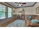 Cozy living room with natural light, ceiling fan, and stylish decor at 149 N Serenity Hill Cir, Chapel Hill, NC 27516