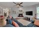 Comfortable living room features a fireplace, large TV, and cozy sectional sofa at 149 N Serenity Hill Cir, Chapel Hill, NC 27516