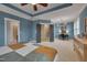 Primary bedroom suite showcasing an ensuite office space, neutral carpet, and natural light at 149 N Serenity Hill Cir, Chapel Hill, NC 27516