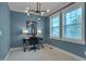 Office space featuring a modern light fixture, natural light, and neutral carpet at 149 N Serenity Hill Cir, Chapel Hill, NC 27516